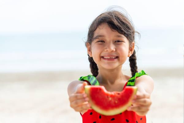 Girl Child Eating Fruit